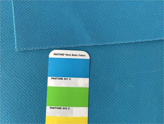 Colored natural rubber material for mouse pads, play mats, and yoga mats